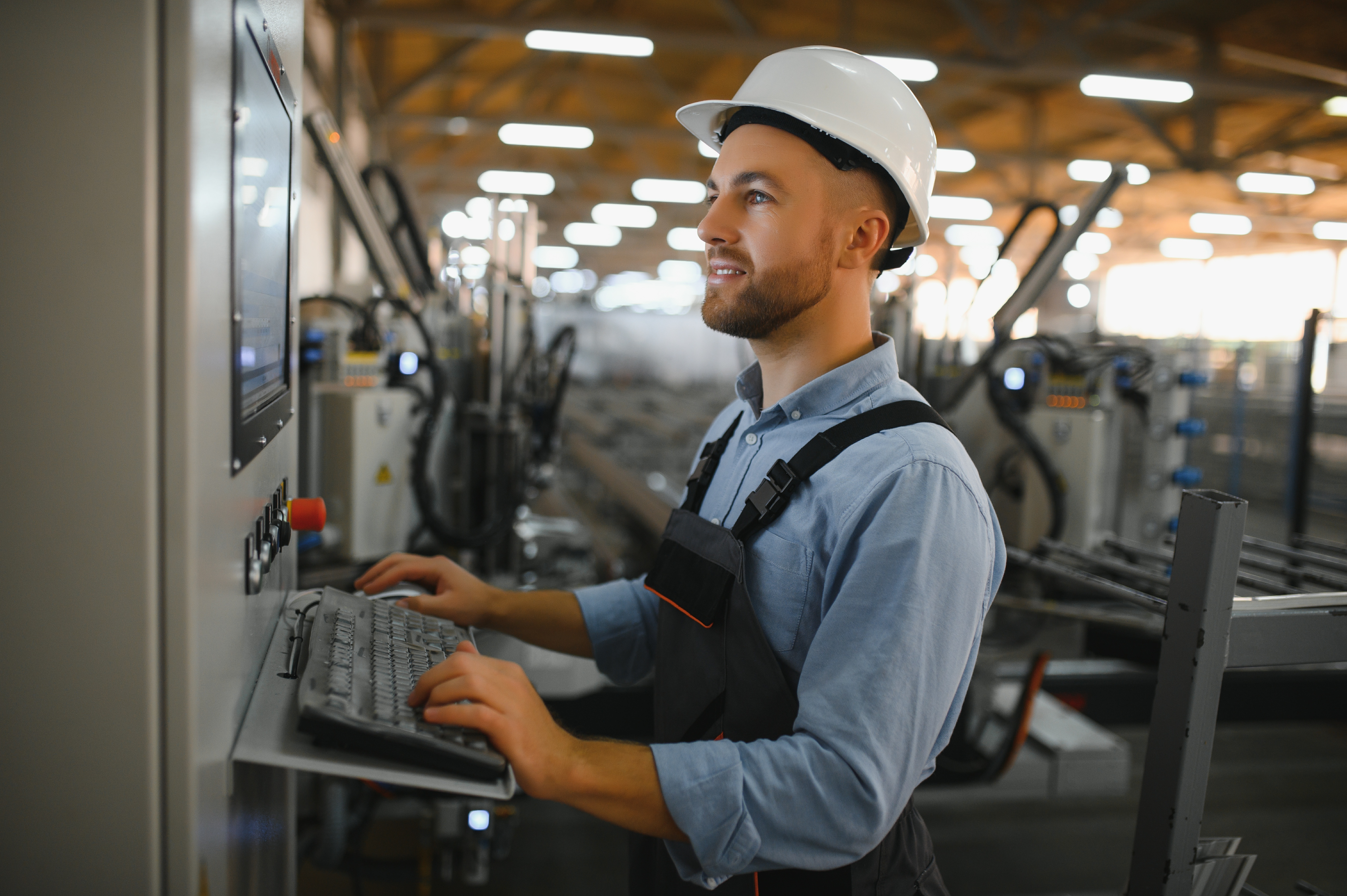 manufacturing employee on computer panel screen